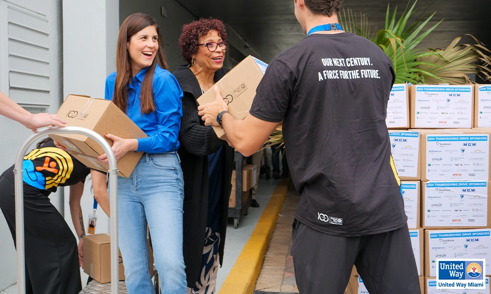 people unloading boxes from a truck