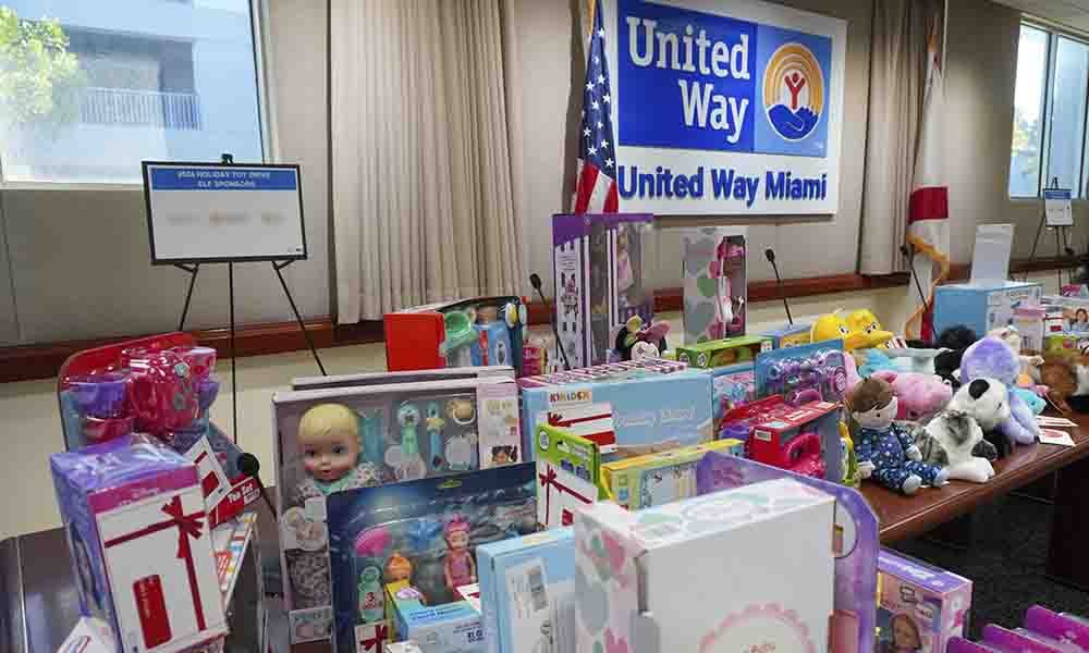 Toys collected from a community toy drive are displayed on a table.