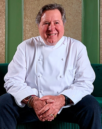 Pictire of a man using white chef coat